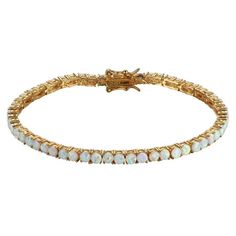 This classic Forever Facets women's tennis bracelet features brilliant October opal birthstones. The 7.25 sterling silver bracelet is plated in 18k yellow gold to enhance the design and includes a tongue in groove clasp and double figure 8 safety catches. Shipped in a jewelry presentation box, ready to be given as a gift to that special someone, it makes a perfect present for birthdays, holidays, Mothers Day, Valentines Day, for bridesmaids or for any special occasions. Size: one size.  Color: O Opal Birthstone, Figure 8, Tennis Bracelet, Womens Bracelets, Sterling Silver Bracelets, Womens Watches, Jewelry Watches, Silver Bracelet, 18k Gold