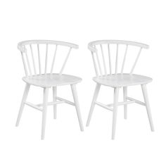 two white chairs sitting next to each other