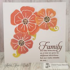 an orange and white card with flowers on it