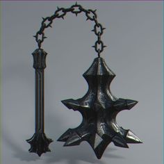 a metal object with chains hanging from it's sides on a gray background,