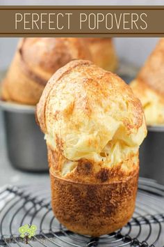 two muffins on a cooling rack with the words perfect popovers above them