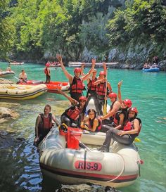 a group of people on rafts in the water