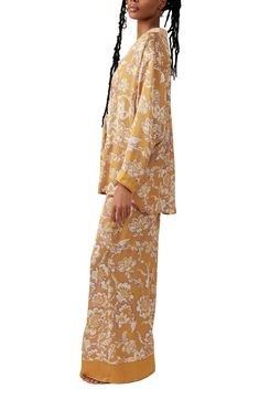 Make bedtime a bit more boho in flowery pajamas that live up to their dreamy designation. 28 1/2" to 31" top length; 28" inseam; 32" leg opening; 14" front rise; 17" back rise (size Medium) Top has spread collar; long sleeves 100% polyester Hand wash, line dry Imported Floral Print Sleepwear With Relaxed Fit Long Pants, Floral Print Relaxed Fit Long Sleepwear Pants, Floral Print Relaxed Fit Pajamas, Floral Print Sleepwear Long Pants For Loungewear, Floral Print Relaxed Fit Sleepwear For Bedtime, Floral Print Sleepwear With Relaxed Fit For Bedtime, Relaxed Fit Floral Print Sleepwear For Bedtime, Spring Printed Relaxed Fit Sleepwear, Printed Relaxed Fit Sleepwear For Spring