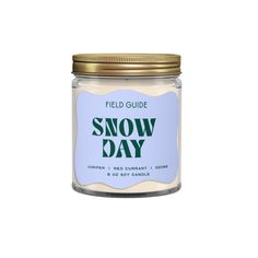 a glass jar filled with snow day candles