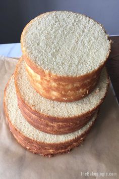 a stack of bread sitting on top of a piece of wax paper