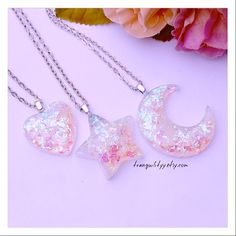 Welcome, I have for you an awesome pink shift cellophane glitter moon, star, and heart resin necklace, check the size with the photo. Your pendant will come in a gift box, thank you for your support, and many blessings, take care. 💕 MEASUREMENTS: Heart 1" across Moon 1 3/4" x 1 5/8" Star 1 3/8" x 1 3/8" Kawaii Moon, Glitter Necklace, Heart Resin, Shine Bright Like A Diamond, Necklace Heart, Celestial Jewelry, Resin Necklace, Pink Stars, Moon Star