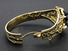 "Beautiful Art Nouveau style bracelet by Whiting and Davis with a contrasting geode style rhinestone centerpiece. I love the contrast that this element provides. Closes with a push in clasp and safety chain that is secured with a safety chain. SIZE/CONDITION: Like new condition. Fits a small to small/medium wrist size. (Mine is 6.25\" around and is about the largest that would fit.) About 1.5\" from top to bottom in the front. LINKS: Looking for a VINTAGE BRACELET, and this isn't the one? Click Antique Bracelet For Evening Wear, Unique Evening Bracelet Jewelry, Adjustable Hinged Bracelet Jewelry, Adjustable Hinged Bracelet, Adjustable Jeweled Cuff Bracelet For Formal Events, Adjustable Jeweled Cuff Bracelet For Formal Occasions, Formal Adjustable Jeweled Cuff Bracelet, Adjustable Formal Cuff Bracelet With Jewels, Collectible Costume Jewelry Bangle