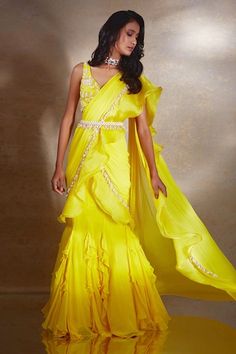 Yellow pre-draped ruffle saree with bead and pearl tasselled edges on a draped silhouette and frilled hem. Comes with floral embroidered blouse and pearl embellished belt. - Aza Fashions Yellow Corset, Pearl Belt, Corset Blouse, Ruffle Saree, Embellished Belt, Drape Saree, Yellow Saree, Winter Sun, Fashion App