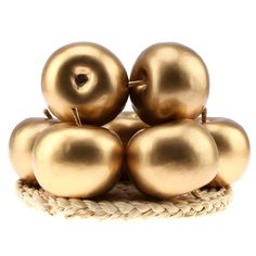 gold apples are stacked on top of each other