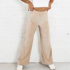 New. Want Style And Comfort All In One Trouser? Our Obeli’s Are For You! Featuring An Elasticated High Waisted Fit, Wide Leg In A Tan Velvet Ribbed Finish. Pair With Docs And A Simple White Crop Or Our Matching Guan Top In Velvet Tan To Complete Your Outfit! Fabric Content: 96% Polyester 4% Spandex I Have The Set In Another Ad Cozy Lounge Relaxed Trendy Relaxed Fit Neutral Pants, Trendy Neutral Loungewear Bottoms, Beige High Waist Bottoms For Loungewear, High-waisted Neutral Bottoms For Loungewear, Trendy Stretch Neutral Bottoms, Brown High-waisted Lounge Pants, Cream High-waisted Lounge Pants, Beige Full-length Loungewear Bottoms, Track Suits Women