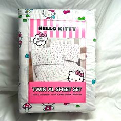 the hello kitty twin sheet set is pink and white