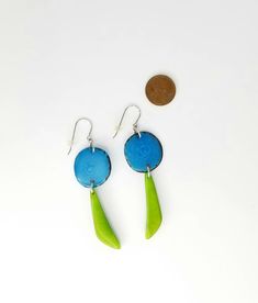 "These very light earrings in turquoise blue and lawn green are a breeze to wear. Lots of movement and a splash of color from these natural tagua beauties! The earrings are long. Each pair is a little different but on average they measure 2 3/4\"." Unique Green Teardrop Earrings, Unique Hypoallergenic Turquoise Earrings, Distinctive Hypoallergenic Turquoise Earrings, Hypoallergenic Turquoise Earrings, Unique Green Pierced Earrings, Unique Green Dangle Earrings, Unique Green Nickel-free Earrings, Unique Blue Hypoallergenic Earrings, 14th Anniversary Gifts