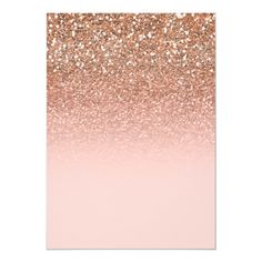 a pink and gold ombreed card with glitter on the bottom, in front of a white background