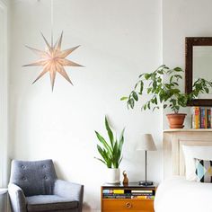 a bed room with a neatly made bed and a chair