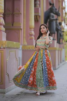 "A vibrant pack of all colors summer! The beautiful handblock printed skirt with peach gota lace and cotton lace at the hem, is a burst of spring hues. The skirt is made with a combination of orange, yellow, green and navy blue printed fabrics. Made in pure cotton, the skirt comes up with a chevron striped shirt with a Chinese collar. The shirt can be separately worn over denims on a bright sunny day. To complete the look, we've teamed it up with some handcrafted multicolor mirror work bangle se Shirt Color Combinations, Drape Sarees, Ghaghra Choli, Chinese Collar, Indian Gowns, Printed Skirt, Traditional Fabric, Chevron Stripe, Desi Fashion