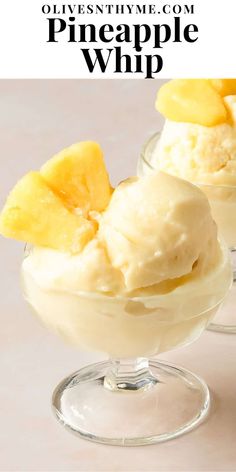 two glasses filled with ice cream and pineapple