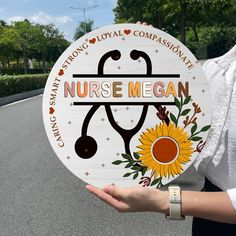 a woman holding up a sign that says nursemegan on the side of the road