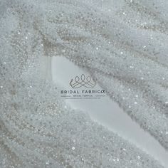 📏 Width: 54" / 135 cm       Tulle lace fabric embroidered with beads that will make your head spin with its sparkle.        Our lace's difference from similar products is 135 cm/54" width, density and brightness of embroideries.       You can use this heavy lace, which we embroidered with high quality beads and sequins on a quality tulle, to make your most special dress design, wedding dress, bridal cape and veil. 🎨 REAL COLOR 🎨 We always take care to take the most accurate photos to show our White Beaded Tulle Fabric For Wedding, White Beaded Fitted Sequin Fabric, White Sequin Fabric With Pearl Embroidery For Wedding, White Beaded Sequin Fabric For Wedding, White Beaded Embroidered Fabric For Wedding, White Sequin Fabric For Ceremony, White Sequin Fabric With Delicate Lace For Wedding, Bridal Apparel, Wedding Dress Ivory