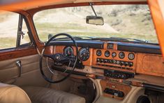 the interior of an old car with dashboards and gauges