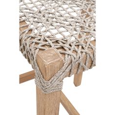 a close up of a chair with rope on it