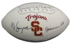 an autographed football with the team's name on it