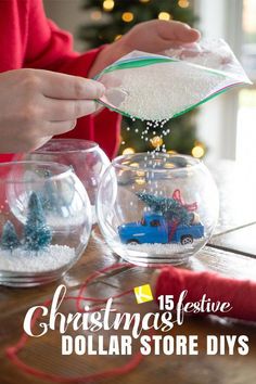 a person pouring sand into small glass bowls with christmas trees in them and the words christmas festive dollar store diys