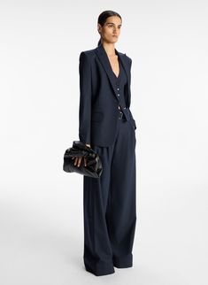 The Mavis II Jacket is crafted from our classic navy pinstripe tailoring fabric. This boxy blazer is designed for an oversize fit, featuring peak lapels, flap pockets, and a single button closure. Shop Jackets Styling Tip: ﻿Pair with the coordinated Emma Pant and Woodson Vest for a modern approach to a tailored, three-piece suiting look. Womens Graduation Suit, Navy Pinstripe Suit Women, Navy Pinstripe Blazer Outfit Women, Navy Pinstripe Pants Outfit, Woman Suit Fashion Modern, Oversized Suit Women, Navy Suit Women, Suit Jacket Outfits For Women, Two Piece Outfits Pants Classy