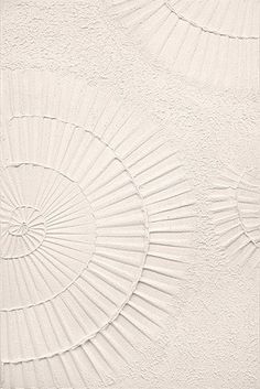 an abstract white background with three circular designs on it's side and the top part of the wall