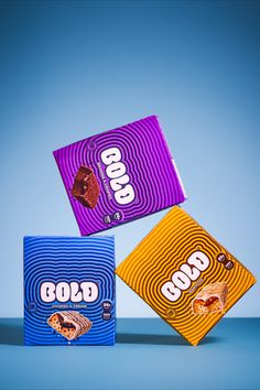 three different types of candy bars on a blue background