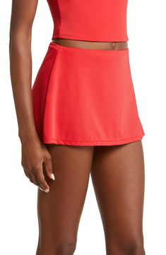 These vintage-inspired bikini bottoms have seriously cute full coverage with a dainty skirt all around. 11 1/2" length (size Medium)   Lined   Full coverage back   80% recycled nylon, 20% spandex   Hand wash, dry flat   Imported Stretch Tennis Skirt With Built-in Shorts For Beach, Fitted Skirt With Built-in Shorts For Beach Season, Fitted Skirted Swimwear With Built-in Shorts, Skirted Bottoms For Swimming Beachwear, Summer Stretch Swim Skirt With Lining, Solid Color Stretch Skirted Swimwear, Fitted Red Swim Skirt For Summer, Beachwear Mini Skort, Summer Fitted Tennis Skirt For Beach