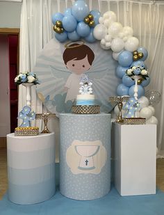 a blue and white baby shower party with balloons, decorations, and table cloths