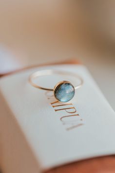 Our Dori ring is made with a gorgeous Labradorite stone. This mystical gemstone is believed to enhance mental clarity and bring about transformation. It's a crystal connected to the third eye chakra which is our gateway to inner wisdom and deeper intuition. 8mm round or 6x8mm oval labradorite stone. Ring band measures 1mm wide. Available in 14kt Gold Fill + Sterling Silver. Juliann stacks it with our Swell Ring and 2 Confetti Rings. KJ pairs it with our Sonder Ring, Raye Ring, and Confetti Ring. Confetti Rings, Confetti Ring, Copper Uses, Everyday Wear Jewelry, The Third Eye, Inner Wisdom, Black Sapphire, Third Eye Chakra, Mental Clarity