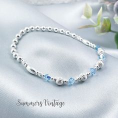 This elegant sterling silver bracelet featuring Aquamarine Swarovski crystals makes the ideal gift for those who celebrate their birthday in March  March is represented in the Swarovski birthstone chart as Aquamarine, a stunning light blue crystal that symbolizes health, hope, and youth  The eclectic mix of beautiful beads are strung on high quality, strong, professional jewellers' elastic meaning there are no fiddly clasps to deal with, simply roll the bracelet over your hand, and onto your wrist The bracelet is elegantly presented in a grey faux suede jewellery pouch, complete with aftercare instructions and a cleaning cloth, adding to its charm as an ideal gift ☽ SIZE: Available in wrist sizes: Small (17cm), Medium (18cm) or Large (19cm) If you're unsure about sizing please drop me a me Adjustable Birthstone Beaded Bracelets For Anniversary, Silver Crystal Birthstone Bracelet For Birthday, Adjustable Sterling Silver Birthstone Crystal Bracelet, Adjustable Sterling Silver Crystal Birthstone Bracelet, Silver Crystal Bracelet For Birthday And Mother's Day, Adjustable Silver Crystal Bracelet With Birthstone, Adjustable Silver Birthstone Crystal Bracelet, Adjustable Birthstone Crystal Bracelet For Birthdays, Silver Bracelets For Birthday With May Birthstone