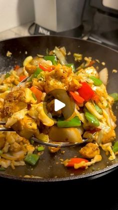 a pan filled with food on top of a stove