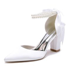 a pair of white shoes with pearls on the heel