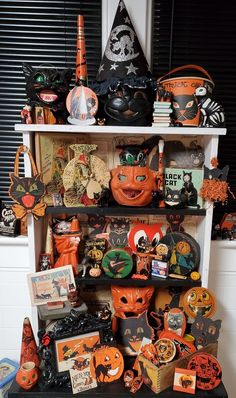 a shelf filled with lots of halloween decorations