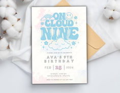 a card with the words one cloud nine on it, next to cotton balls and paper