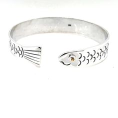 "Our Cape Cod Fish Bracelet is handmade to last a lifetime. Made of .925 Silver and gold filled eye. This bracelet retails for up to 700$ on Cape Cod. The fish resembles a Herring fish and represents all the fish that populate Cape Cod waters. This is the best quality fish found on Cape Cod. Average weight is about 33 grams. 13MM (1/2\") wide We are manufacturers who sell wholesale also (100 Pieces) Located at 304 Commercial St in historic Provincetown Free size exchange when you return to us un One-of-a-kind Bangle Jewelry As Gift, Unique Sterling Silver Bracelet Stamped 925 As Gift, Sterling Silver Cuff Bracelet With Clasp As Gift, Unique White Gold Bracelets As A Gift, Sterling Silver Clasp Bangle For Gift, Sterling Silver Fish-shaped Jewelry Gift, Sterling Silver Fish-shaped Jewelry As Gift, Unique Hallmarked Sterling Silver Bracelet As Gift, Handmade Fish-shaped Jewelry Gift