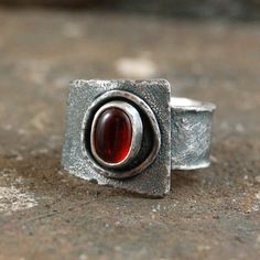 "Garnet silver ring. Dimensions: -stone 0.5 - 0.7 cm, 0.2 - 0.28\" -band width 0.9 - 1.6 cm, 0.35 - 0.63\" -size adjustable (please write me your size, I'll set it)." Modern Handmade Wide Band Jewelry, Modern Wide Band Gemstone Rings, Modernist Wide Band Open Ring Gift, Unique Silver Open Ruby Ring, Wide Bands, Statement Ring, Statement Rings, Garnet, Silver Ring