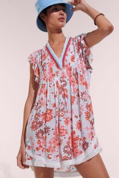 The Sasha dress from Poupette St. Barth is one of their best selling silhouettes. It has a trapeze shape with a striking fringed v-neck, butterfly sleeves, and a curved double hem trimmed in lace. Offered in the Blue 90s print. 100% eco-responsible Viscose Hand wash cold. Hang dry. Made in Indonesia Women Sundresses, Luxurious Resort, Poupette St Barth, Cooler Style, Mini Dresses For Women, St Barth, Butterfly Sleeves, Mini Dresses, Resort Wear