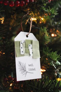 a christmas ornament hanging on a tree with the words well i cred