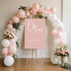 a pink and white wedding sign surrounded by balloons