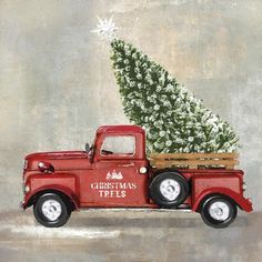 an old red truck with a christmas tree in the back