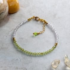 Peridot and Cubic Zirconia bracelet handcrafted using 3mm AAA faceted Peridot beads, 3mm AAA faceted Cubic Zirconia beads, 2mm gold  fill beads and fastened using a gold plated lobster claw clasp and 25mm extension chain for an adjustable fit. Peridot is one of the birthstones for August and would make a charming birthday gift. Peridot is the 16th anniversary gift on modern anniversary gift lists and this bracelet would make the perfect gift as a token of love. Peridot is known as the stone of c Faceted Round Bead Bracelets For May Birthstone, Faceted Round Beads Bracelet For May Birthstone, Adjustable Faceted Bead Bracelets For May Birthstone, Faceted Beads Bracelets As May Birthstone Gift, Faceted Beads Bracelet For May Birthstone Gift, May Birthstone Faceted Beads Bracelet, May Birthstone Bracelets With Faceted Beads As Gift, Faceted Rondelle Beaded Bracelets As Gift, Healing Crystal Bracelet With Birthstone And Round Beads