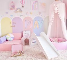 a child's play room with pink furniture and accessories on the floor, including a slide