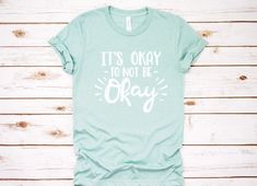 It's okay to not be Okay *Distressed* / Motivational Shirt /  Counselor Shirt / Teacher Shirts / Mental Health / Mental Wellness by CounselorMomDesigns on Etsy https://www.etsy.com/listing/640792090/its-okay-to-not-be-okay-distressed Scatter Kindness, Graphic Tees Funny, Kindness Shirt, Funny Fishing Shirts, Cross Shirts, Funny Fishing, Kindness Matters, Yoga Shirt, Clothes Casual