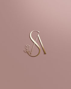 the letter s is made up of gold foil and has a flower on it's side