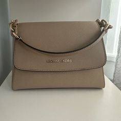 Light Beige Handbag/Crossbody. Barely Worn , Still In Great Condition. Selling Because It’s Not My Style Anymore. Has A Small Scratch On The Side And A Small Stain On The Front Flap. Michael Kors Handbags Crossbody, Beige Handbag, Beige Handbags, Michael Kors Handbag, Bags Michael Kors, Handbags Michael Kors, Light Beige, Cross Body Handbags, Michael Kors