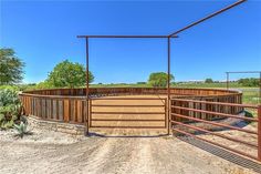 a fenced in area with a cow pen