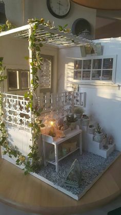 a doll house is set up on a table